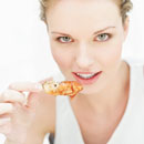 Atkins diet - woman eating chicken