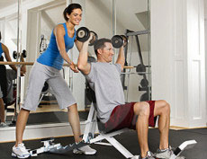 man and woman in gym