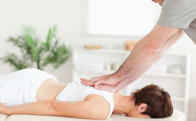 Chiropractor working on patient for weight loss